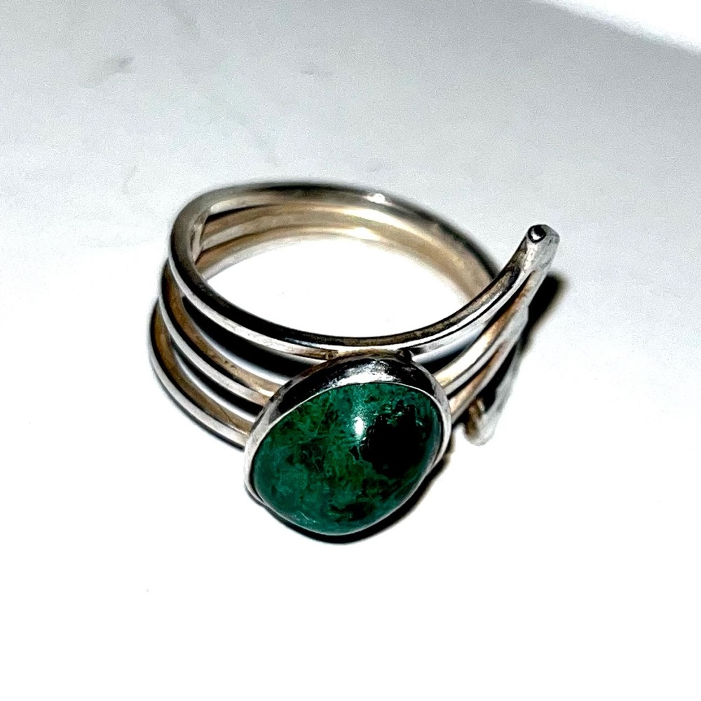 Silver ring with turquoise stone. Size 8 and can be adjusted larger.